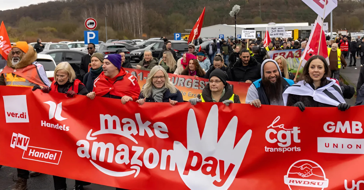 Amazon workers from Germany joined colleagues from the U.S., Sweden, the U.K., and Italy seen in an international protest on Black Friday, November 29, 2024.
Image Source: Christian Lademann via Getty Images